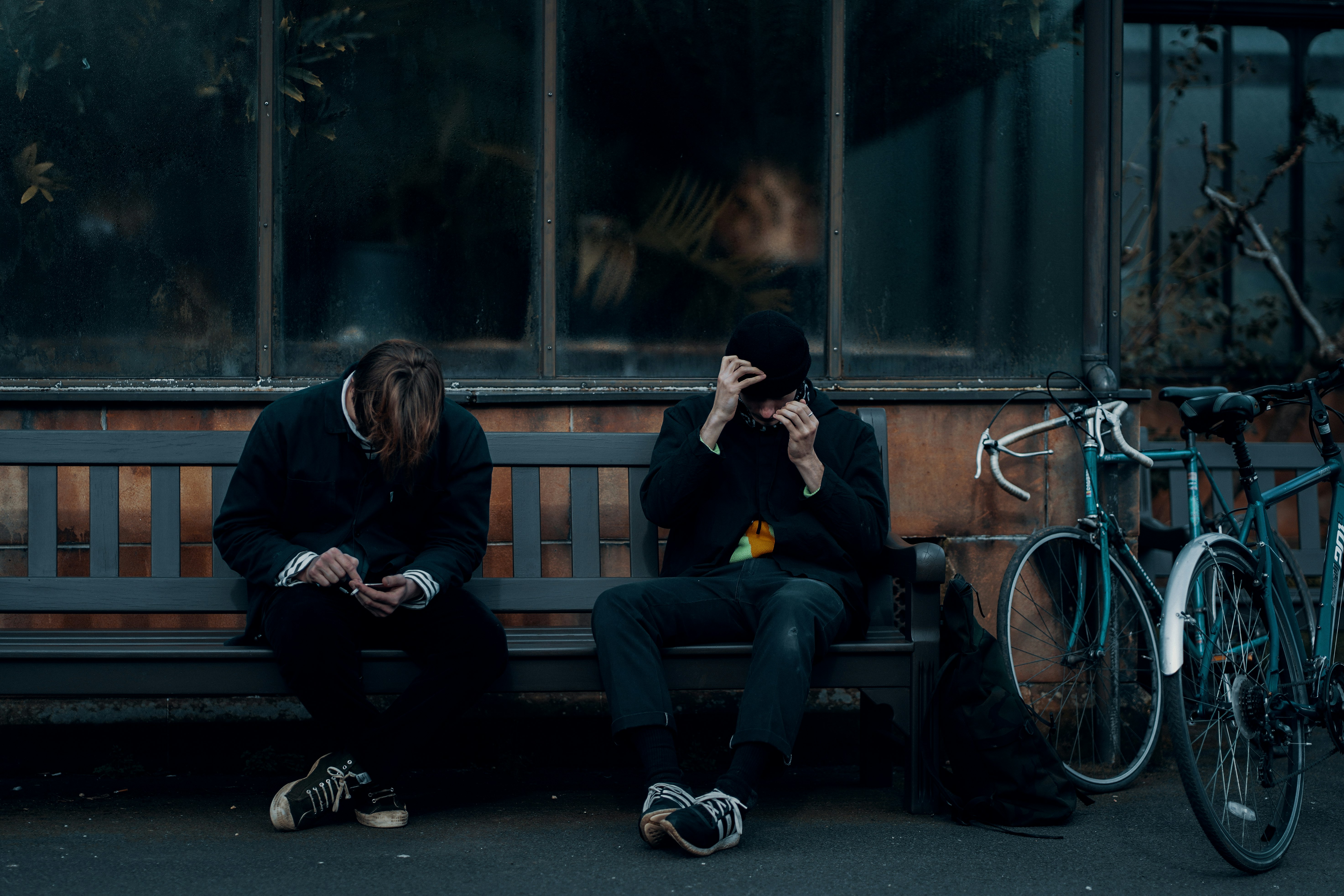 2 women sitting on bench